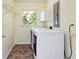 Well-equipped laundry room with modern washer and dryer and convenient shelving at 3999 Phils Ct, Tucker, GA 30084