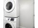 Efficient laundry area showcasing stacked washer and dryer units at 3999 Phils Ct, Tucker, GA 30084