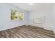 Bright living room with hardwood floors, a decorative brick fireplace, and a large window at 3999 Phils Ct, Tucker, GA 30084