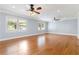 Spacious living room featuring hardwood floors, neutral paint, large windows, and recessed lighting at 3999 Phils Ct, Tucker, GA 30084