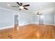 Spacious living room showcasing hardwood floors and two ceiling fans for added comfort at 3999 Phils Ct, Tucker, GA 30084