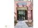 Elegant entrance to 'The Washington' building with glass doors and brick facade at 870 Mayson Turner Nw Rd # 1238, Atlanta, GA 30314