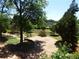 A stone patio outside a residential building is surrounded by trees and manicured lawn at 870 Mayson Turner Nw Rd # 1238, Atlanta, GA 30314