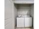 Convenient laundry room closet features a washer and dryer and space-saving shelving at 870 Mayson Turner Nw Rd # 1238, Atlanta, GA 30314