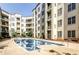 Beautiful in-ground pool surrounded by manicured gardens and a large condo complex at 870 Mayson Turner Nw Rd # 1238, Atlanta, GA 30314