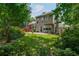 The backyard features green grass and ample space to entertain at 1115 Manor Nw Way, Kennesaw, GA 30144