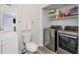 Bathroom with updated fixtures and updated washer and dryer at 1115 Manor Nw Way, Kennesaw, GA 30144