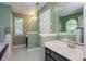 Spacious bathroom featuring dual vanities, a soaking tub, and tiled floors at 1115 Manor Nw Way, Kennesaw, GA 30144