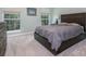 Serene bedroom featuring a comfortable bed, soft carpeting, and natural light for a restful atmosphere at 1115 Manor Nw Way, Kennesaw, GA 30144