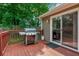 Outdoor deck featuring a grill and sliding glass door, perfect for outdoor cooking and indoor-outdoor living at 1115 Manor Nw Way, Kennesaw, GA 30144
