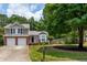 Well-kept home with a two-car garage, landscaped front yard, and a welcoming front porch at 1115 Manor Nw Way, Kennesaw, GA 30144