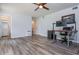 Open living space with luxury vinyl flooring, office and bathroom access at 1115 Manor Nw Way, Kennesaw, GA 30144