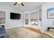 Bright living room featuring hardwood floors, a sofa, a recliner, and a large bay window offering abundant natural light at 1115 Manor Nw Way, Kennesaw, GA 30144