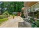 Cozy outdoor patio features seating and a well-kept yard, perfect for relaxing or entertaining at 1115 Manor Nw Way, Kennesaw, GA 30144