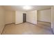 Unfinished basement area with concrete floors, stairs, door, and white painted walls at 3038 Skidaway Ct, Stone Mountain, GA 30087