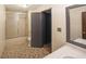 Neutral bathroom featuring a shower-tub combo, tile floors, and white countertops at 3038 Skidaway Ct, Stone Mountain, GA 30087