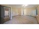 Bedroom with wood-look floors, overhead lighting and view of adjoining room at 3038 Skidaway Ct, Stone Mountain, GA 30087