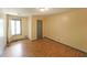 Bedroom featuring hardwood floors, a window, neutral colored walls, and a door to a closet at 3038 Skidaway Ct, Stone Mountain, GA 30087