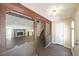 Inviting entryway with stone fireplace, wood beams, and open floor plan at 3038 Skidaway Ct, Stone Mountain, GA 30087