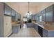 Eat-in kitchen features vaulted ceiling, tile flooring, and ample cabinetry at 3038 Skidaway Ct, Stone Mountain, GA 30087
