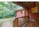 A covered back porch overlooks a lush, green lawn at 44 Aberdeen St, Atlanta, GA 30307