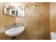 Modern bathroom featuring a sleek sink, decorative mirror, and tiled walls at 44 Aberdeen St, Atlanta, GA 30307