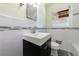 Bathroom featuring sleek vanity, modern sink, and tiled walls offering a clean, updated look at 44 Aberdeen St, Atlanta, GA 30307