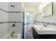 Updated bathroom with a bathtub, glass door, sleek vanity, and a modern faucet at 44 Aberdeen St, Atlanta, GA 30307