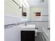 Nicely renovated bathroom featuring tile accents, modern fixtures, and a large sink at 44 Aberdeen St, Atlanta, GA 30307