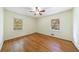 Bedroom featuring hardwood floors and bright windows overlooking trees at 44 Aberdeen St, Atlanta, GA 30307