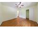 Bedroom with hardwood floors, a ceiling fan, and a spacious closet at 44 Aberdeen St, Atlanta, GA 30307