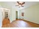 Bedroom featuring hardwood floors, a ceiling fan, closet, and natural light from the window at 44 Aberdeen St, Atlanta, GA 30307
