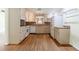 Kitchen with stainless steel appliances, wooden cabinets, and hardwood flooring at 44 Aberdeen St, Atlanta, GA 30307