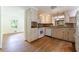Bright kitchen featuring white cabinets, hardwood floors, and stainless steel appliances at 44 Aberdeen St, Atlanta, GA 30307