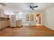 Open kitchen and dining area with stainless steel appliances and hardwood floors at 44 Aberdeen St, Atlanta, GA 30307