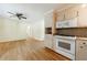 Open-concept kitchen with stainless steel appliances and hardwood flooring at 44 Aberdeen St, Atlanta, GA 30307