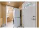Convenient laundry area with stacked washer/dryer and a utility sink next to entry door at 44 Aberdeen St, Atlanta, GA 30307