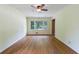 Bright living room with large windows, hardwood floors, and classic ceiling trim at 44 Aberdeen St, Atlanta, GA 30307
