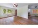 Charming living area featuring hardwood floors, large windows and access to the kitchen at 44 Aberdeen St, Atlanta, GA 30307