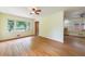 Spacious living room with hardwood floors, ceiling fan, and adjoined room with view to the outside at 44 Aberdeen St, Atlanta, GA 30307