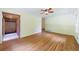 Open living space with hardwood floors, and an entry leading to foyer with brick accent wall at 44 Aberdeen St, Atlanta, GA 30307