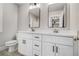 Beautiful bathroom featuring dual vanity with modern hardware, framed mirrors and stylish fixtures at 6355 Akins Way, Cumming, GA 30041
