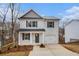 Charming two-story house with a manicured lawn and driveway at 6355 Akins Way, Cumming, GA 30041