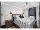 Comfortable bedroom with ceiling fan, modern lighting, and stylish bedding at 1280 W Peachtree W St, Atlanta, GA 30309