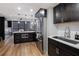 Kitchen with an island with microwave, stainless steel refrigerator, and modern cabinetry at 1280 W Peachtree W St, Atlanta, GA 30309