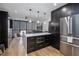 Living room with an island featuring a microwave and stainless steel refrigerator at 1280 W Peachtree W St, Atlanta, GA 30309