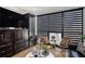 Living room showing dark wood built-ins, striped shades, and modern furnishings at 1280 W Peachtree W St, Atlanta, GA 30309