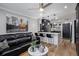 Open-concept living area with a breakfast bar and sleek black furnishings at 1280 W Peachtree W St, Atlanta, GA 30309