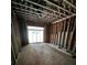 Bedroom framed with exposed studs and door to porch under construction at 314 Fortune Ne St # A, Atlanta, GA 30312