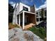 Exterior view of a modern home under construction with a covered porch and large windows at 314 Fortune Ne St # A, Atlanta, GA 30312